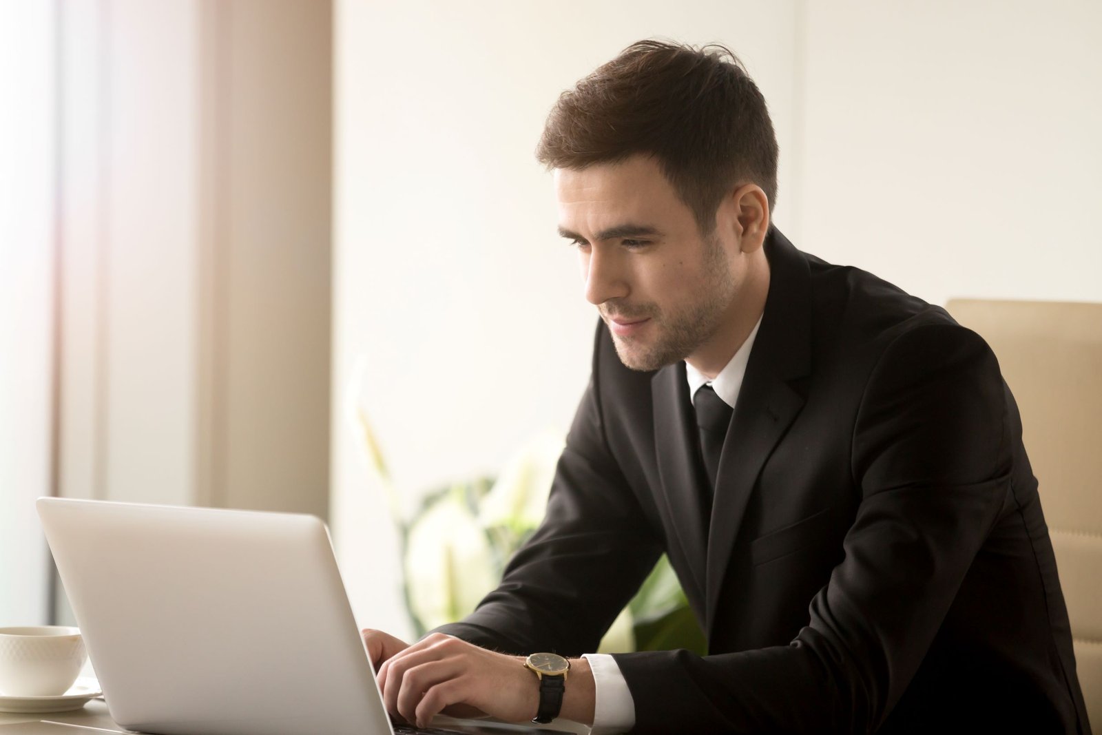 Male office worker enjoying work